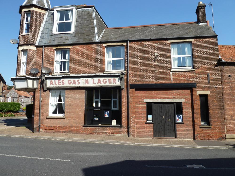 Formerly Allen's Garages, the letters have been rearranged to spell Ales Gas 'N Lager