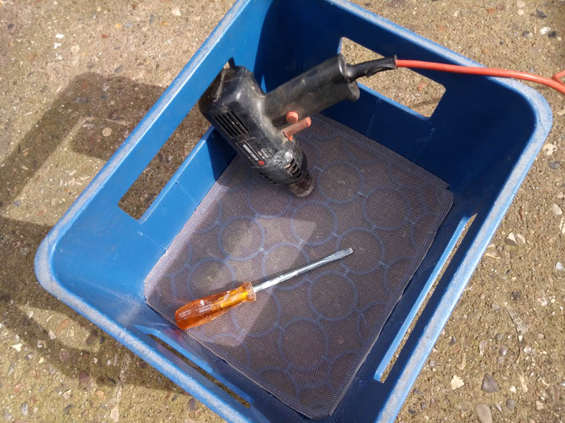 Using a hot air stripper to weld the mesh into the sieve