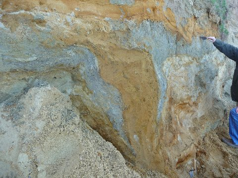 A deformed water-escape structure below a sand basin at West Runton